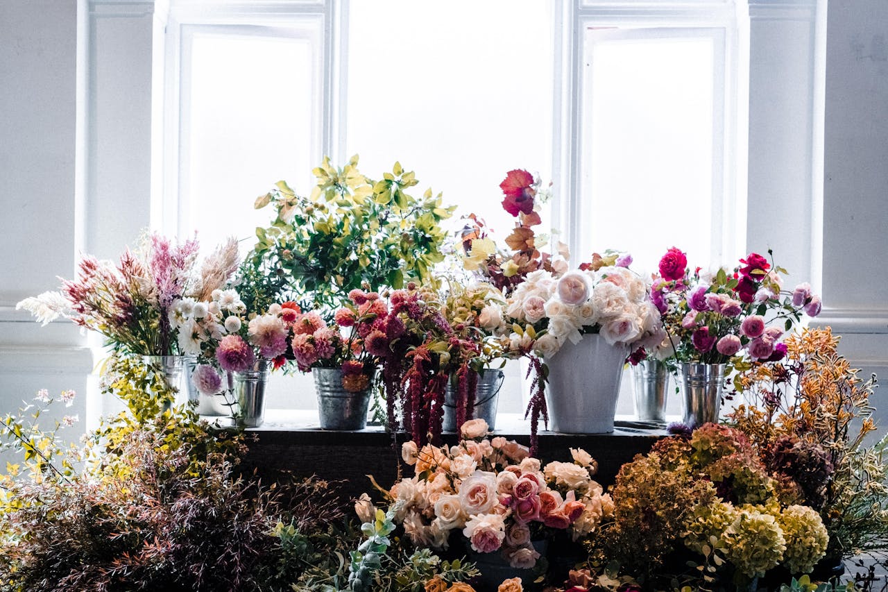 The Art of Drawing Readers In: Your attractive post title goes here Beautiful array of colorful flowers in vases with natural indoor lighting.